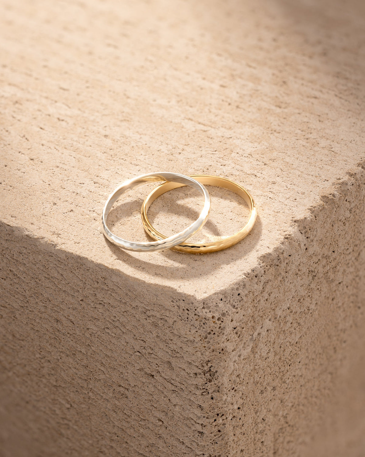 A pair of white and yellow gold wedding bands
